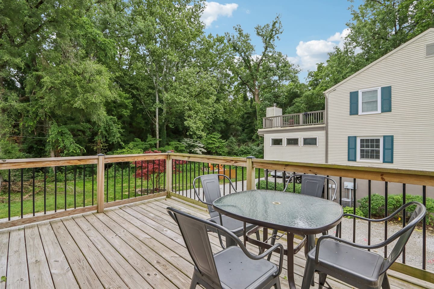 Step outside onto the private deck for fresh air, morning coffee, or a relaxed meal surrounded by greenery.