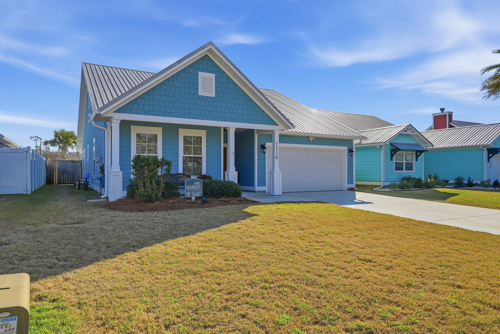 Colorful coastal exterior of this pet-friendly Panama City Beach house near top attractions.