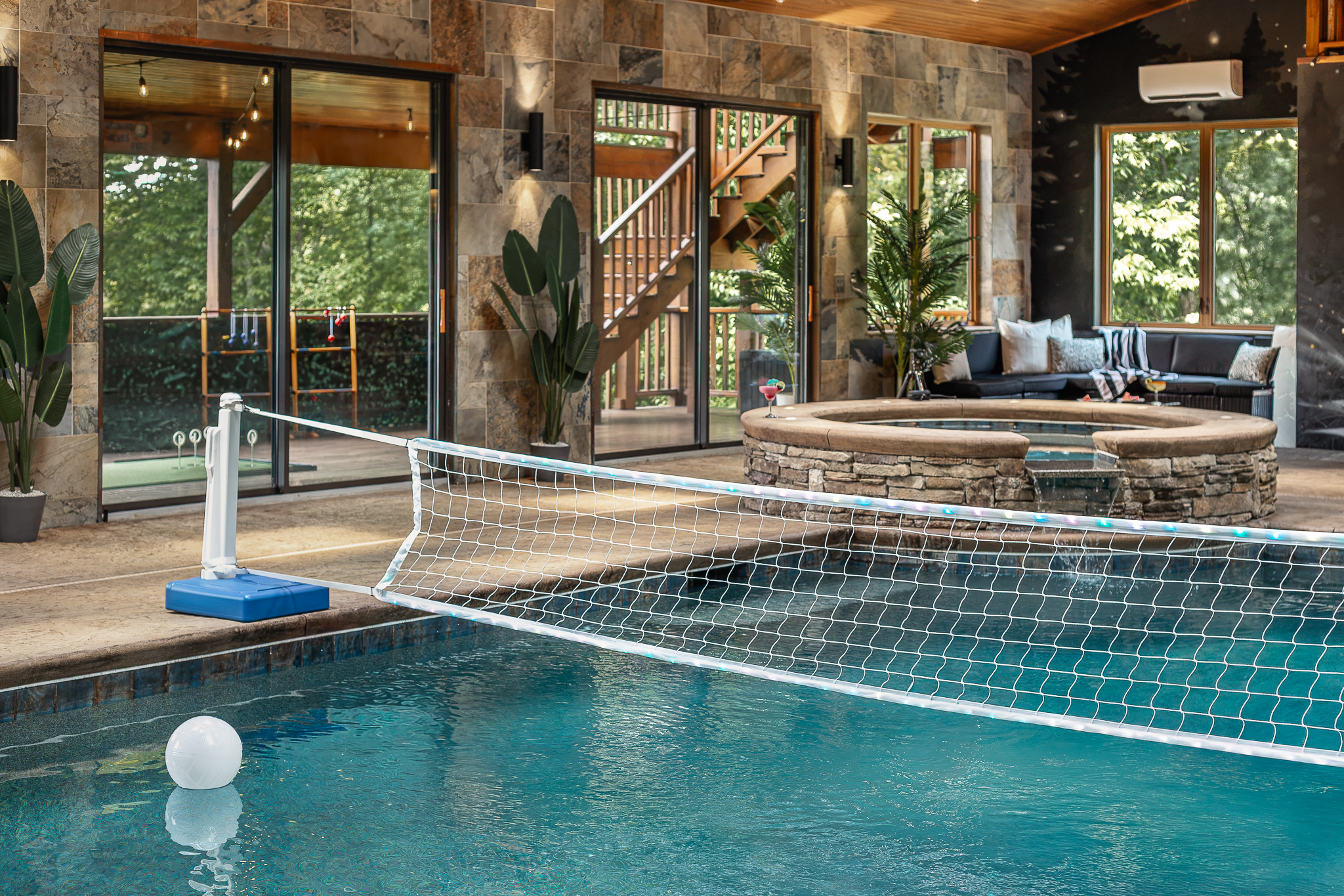 {Indoor Pool} Challenge the group to a game of pool volleyball in your private heated indoor pool—fun in every season and any weather.