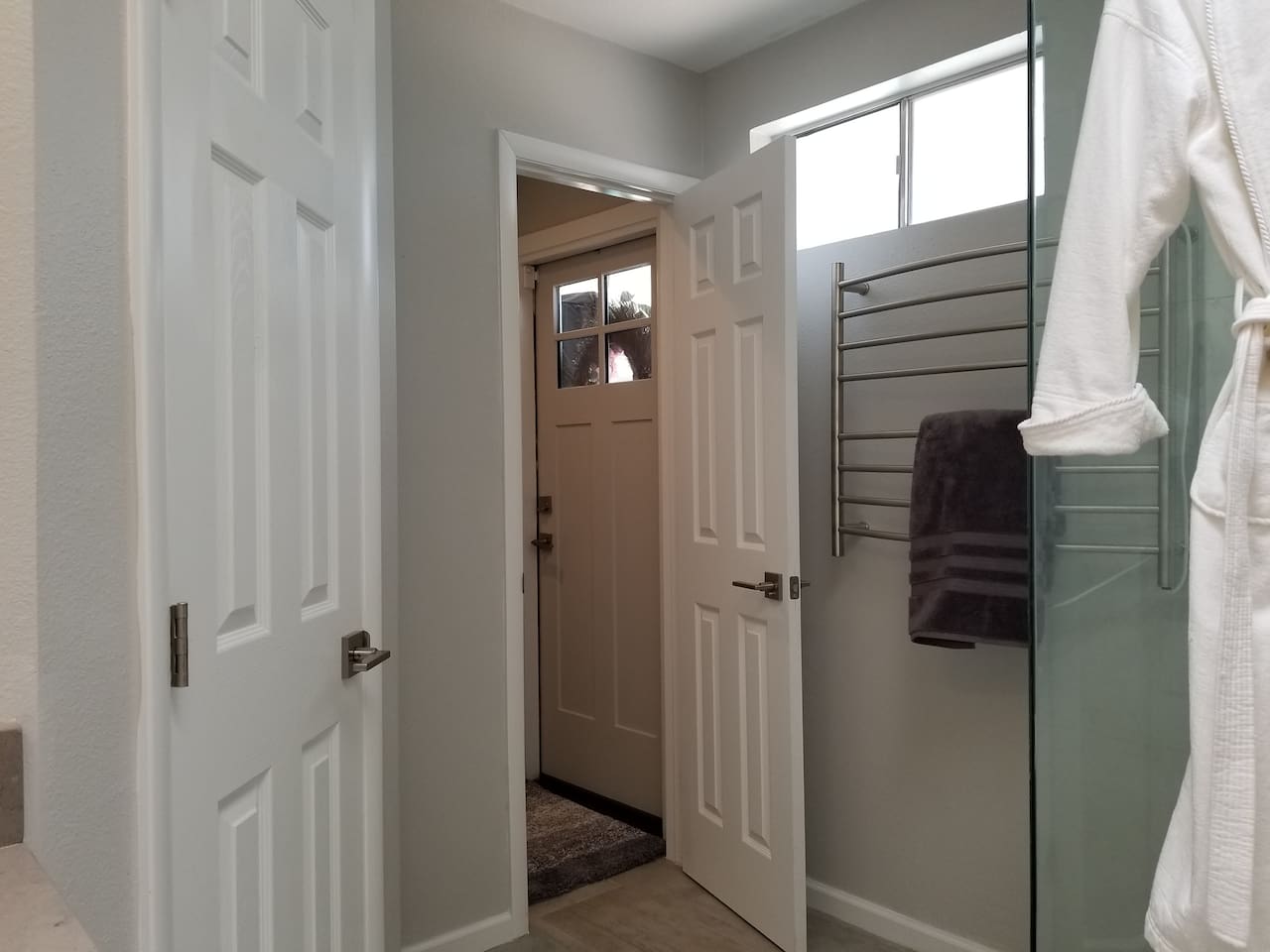 Master bath has a separate Toilet room and backdoor to the pool. Also a towel heater and robe are provided.