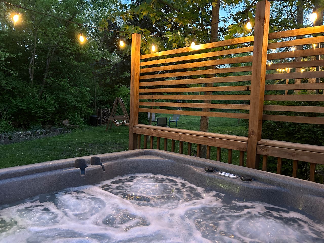 Guests enjoy watching the deer while relaxing in the hot tub. 