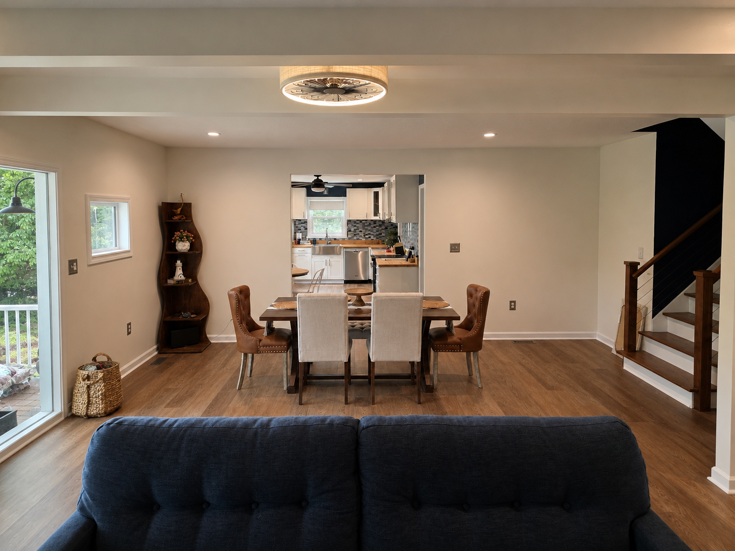 Open main-level living and dining space with comfortable seating, natural light and room to gather.