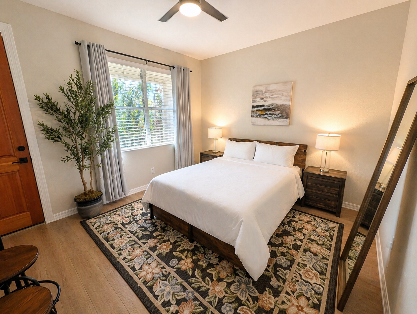 Cozy and well-appointed bedroom with a comfortable bed, soft lighting, and stylish décor. Enjoy natural light from the window and a calm, relaxing atmosphere perfect for a restful night’s sleep.
