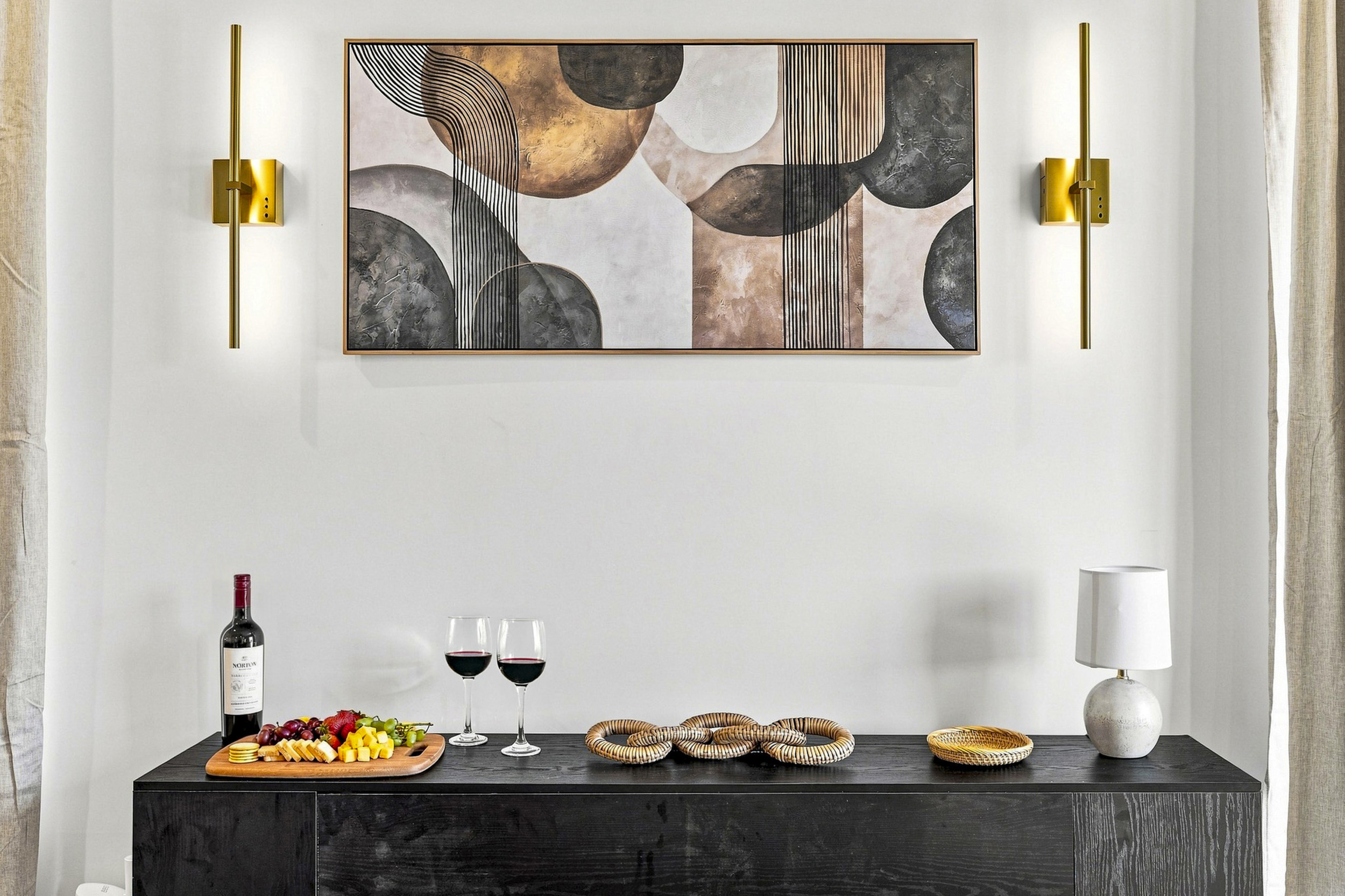 Enjoy elegant decor with artful design, wine, and snacks for perfect relaxation!