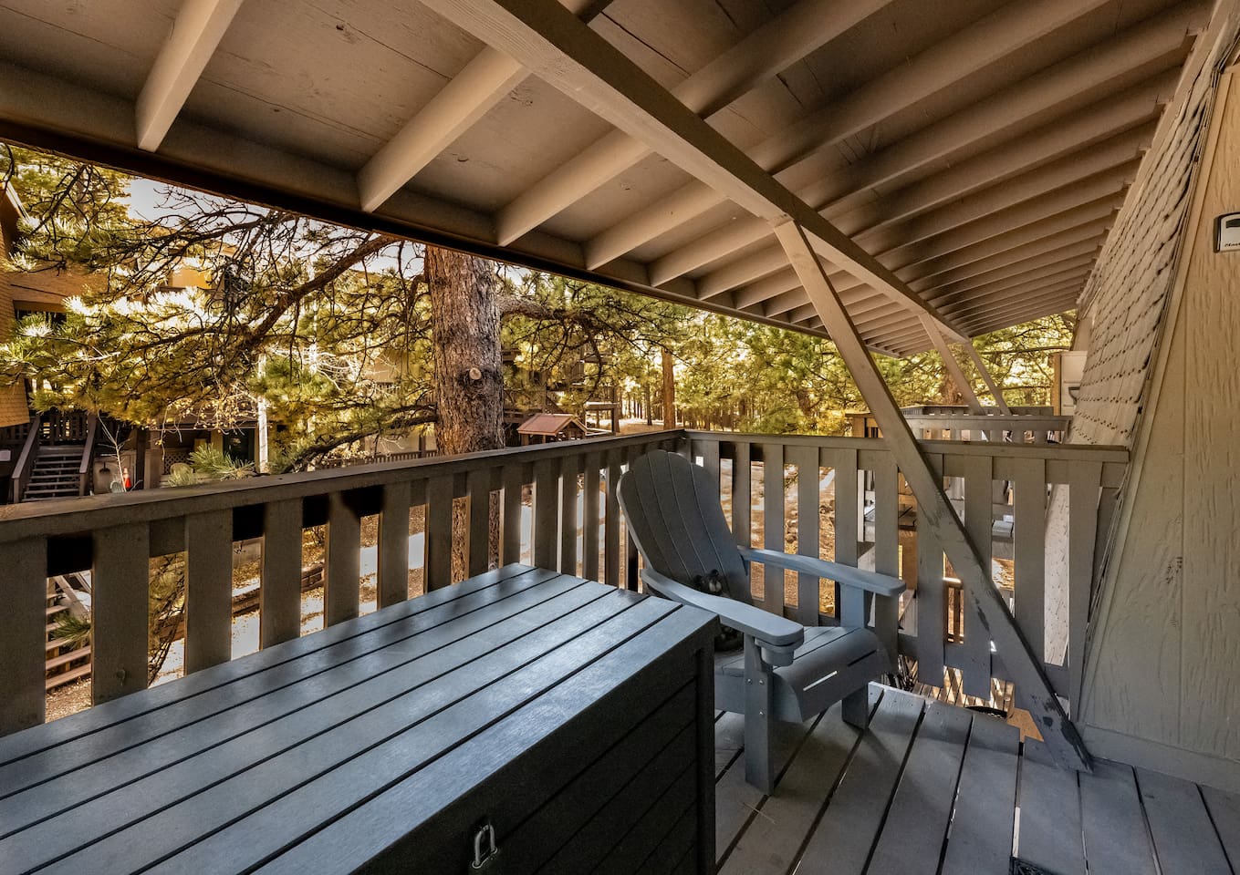 Back porch views with 2 Adirondack chairs for relaxing