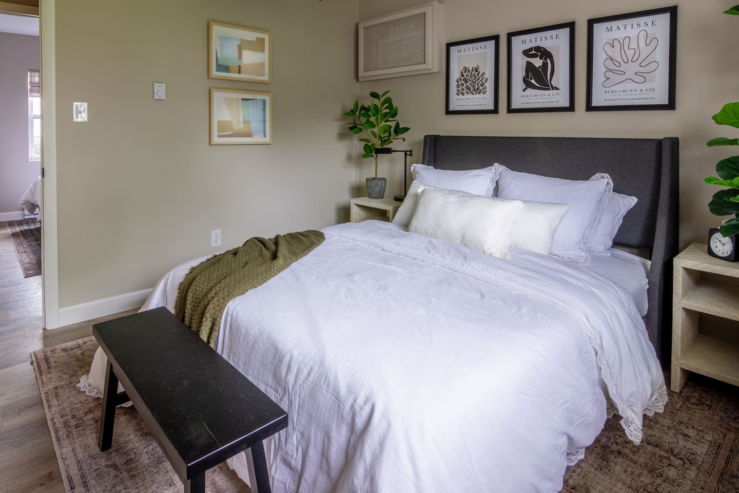 Crisp white linens and a knit throw make this bedroom feel like an easy escape.