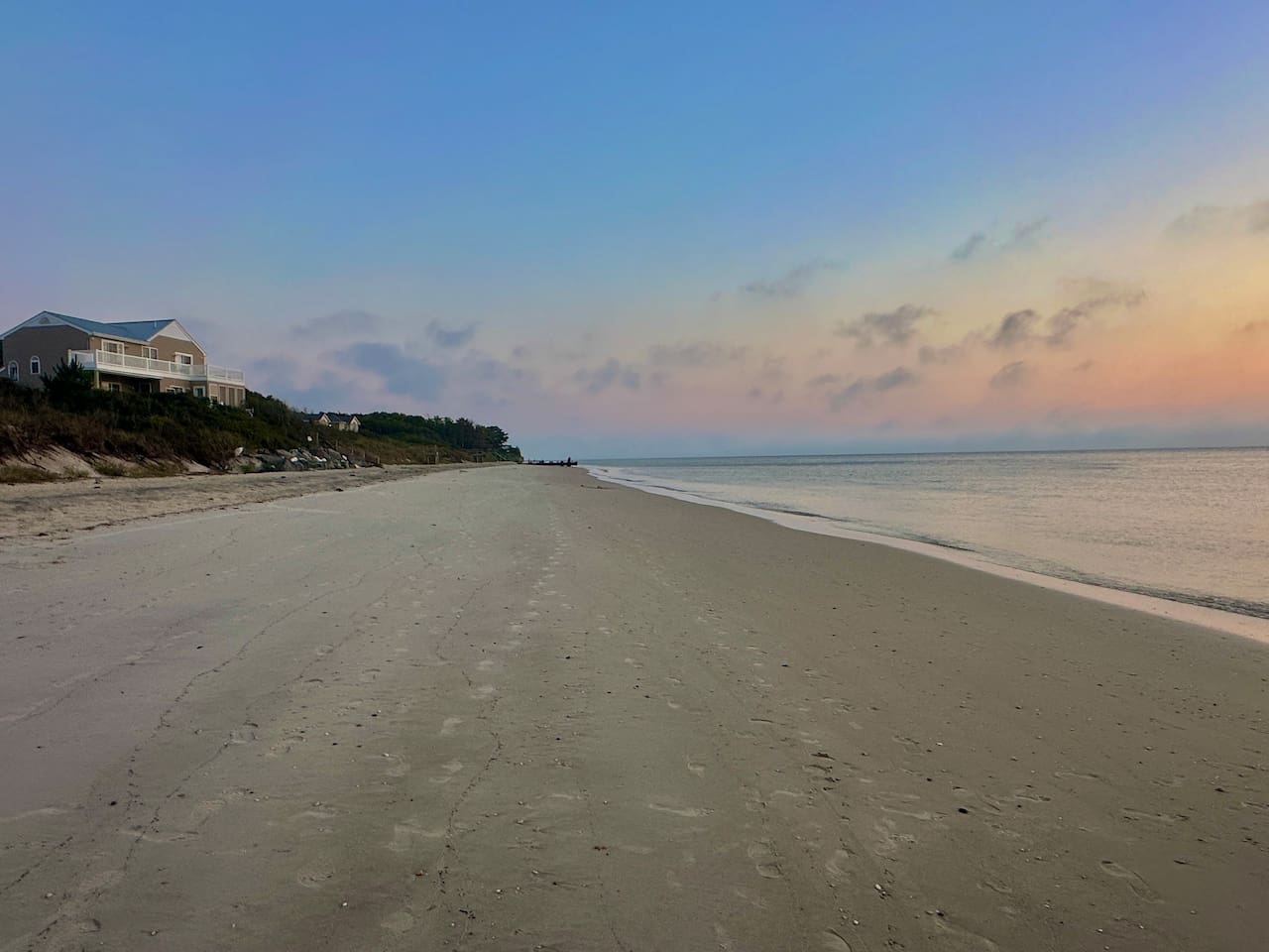 Step onto the soft sand and breathe in the salt air. Our location offers a short walk to direct access to this expansive, peaceful beach—perfect for long morning walks, building sandcastles, or simply watching the waves roll in at twilight.