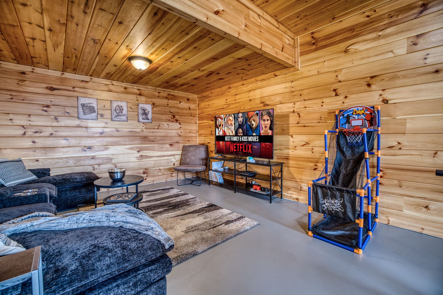 Movie room right off the game room includes big screen smart TV with streaming available, DVD player, and Wii video games!