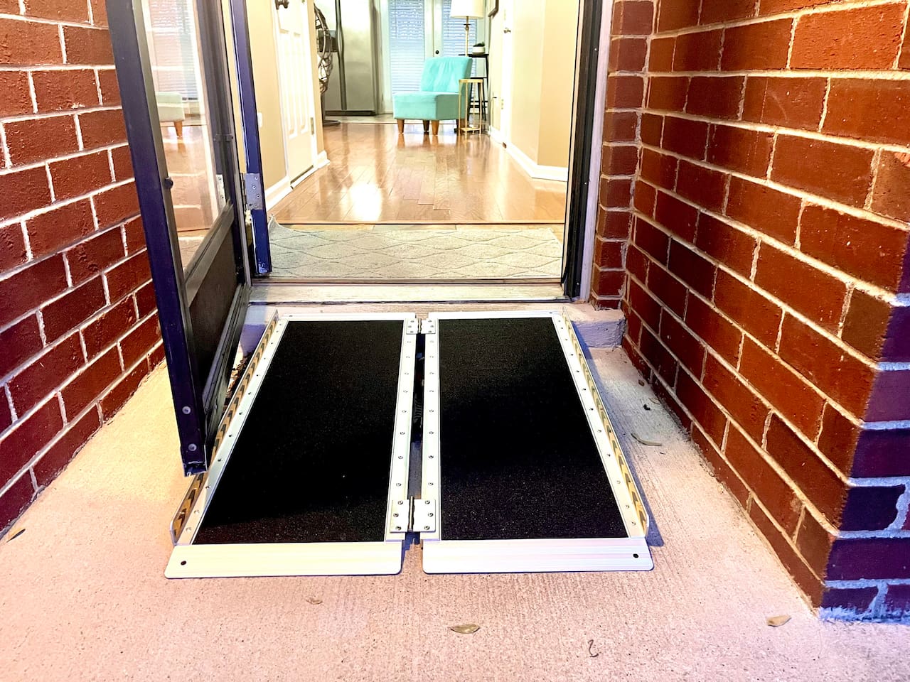 Step-free with portable ramp. This will be folded up in the garage when you arrive. 
