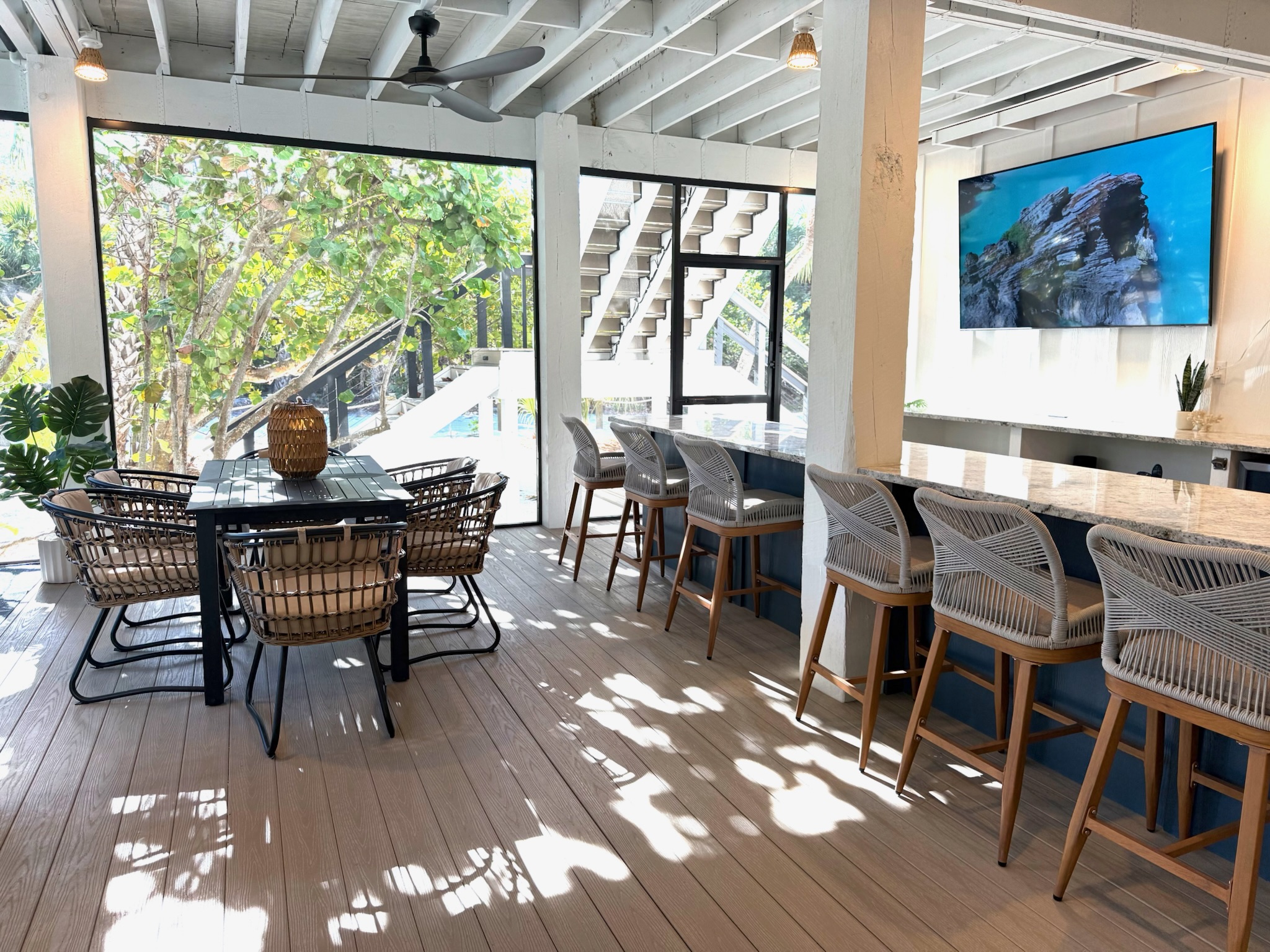 Fix a drink at the wet bar featuring a second beverage fridge and another free-standing ice maker