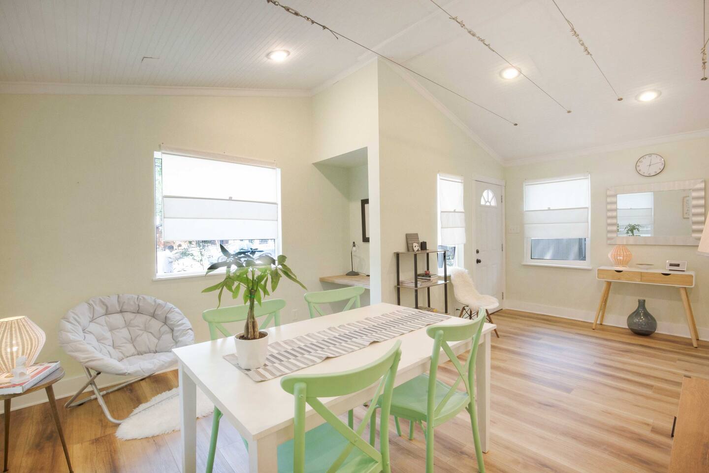 living room has queen bed couch, dining table for 5