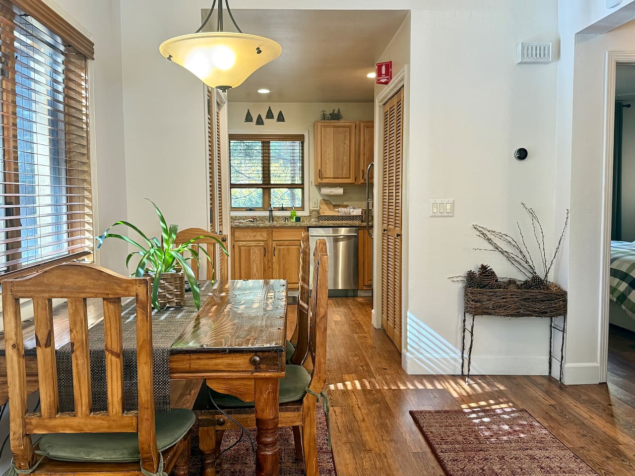The layout flows seamlessly from the living room through the dining area into the kitchen.