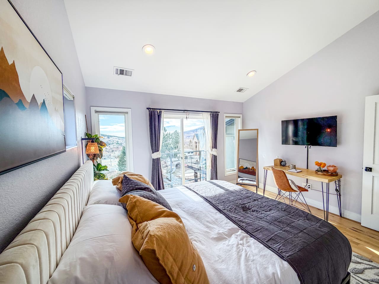 Sink into the cozy king bed after a day of exploring and unwind with your favorite show on the TV. Large windows fill the room with natural light and mountain views, while the private balcony offers a peaceful place to relax.