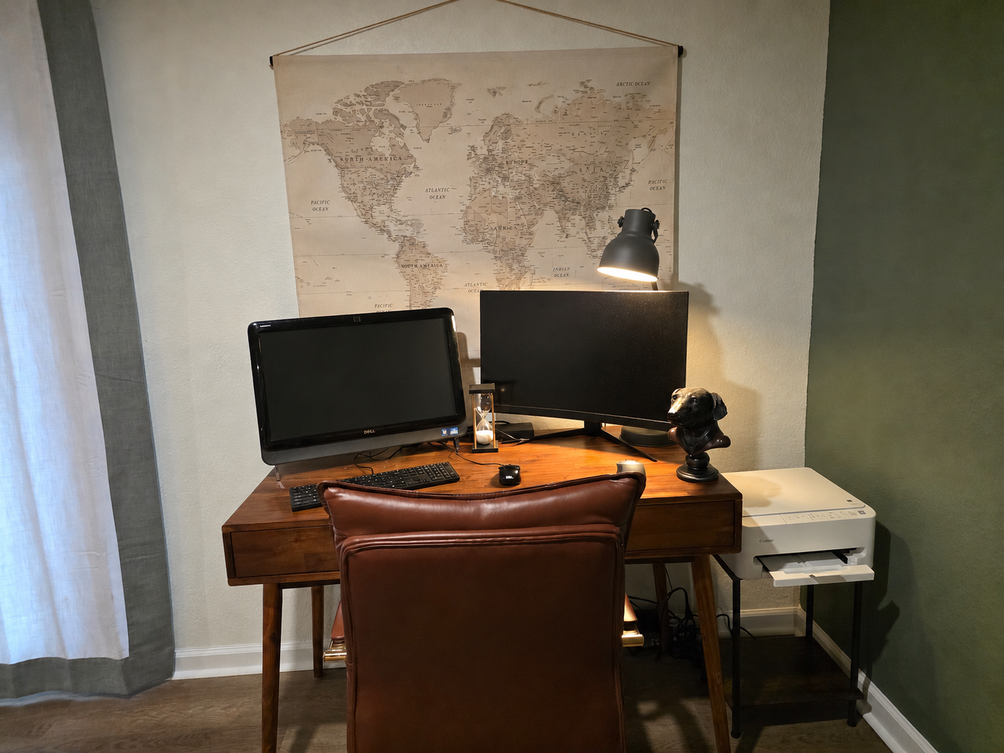 Private workspace in the basement bedroom with a desk, monitor and quiet spot for remote work or planning the day.