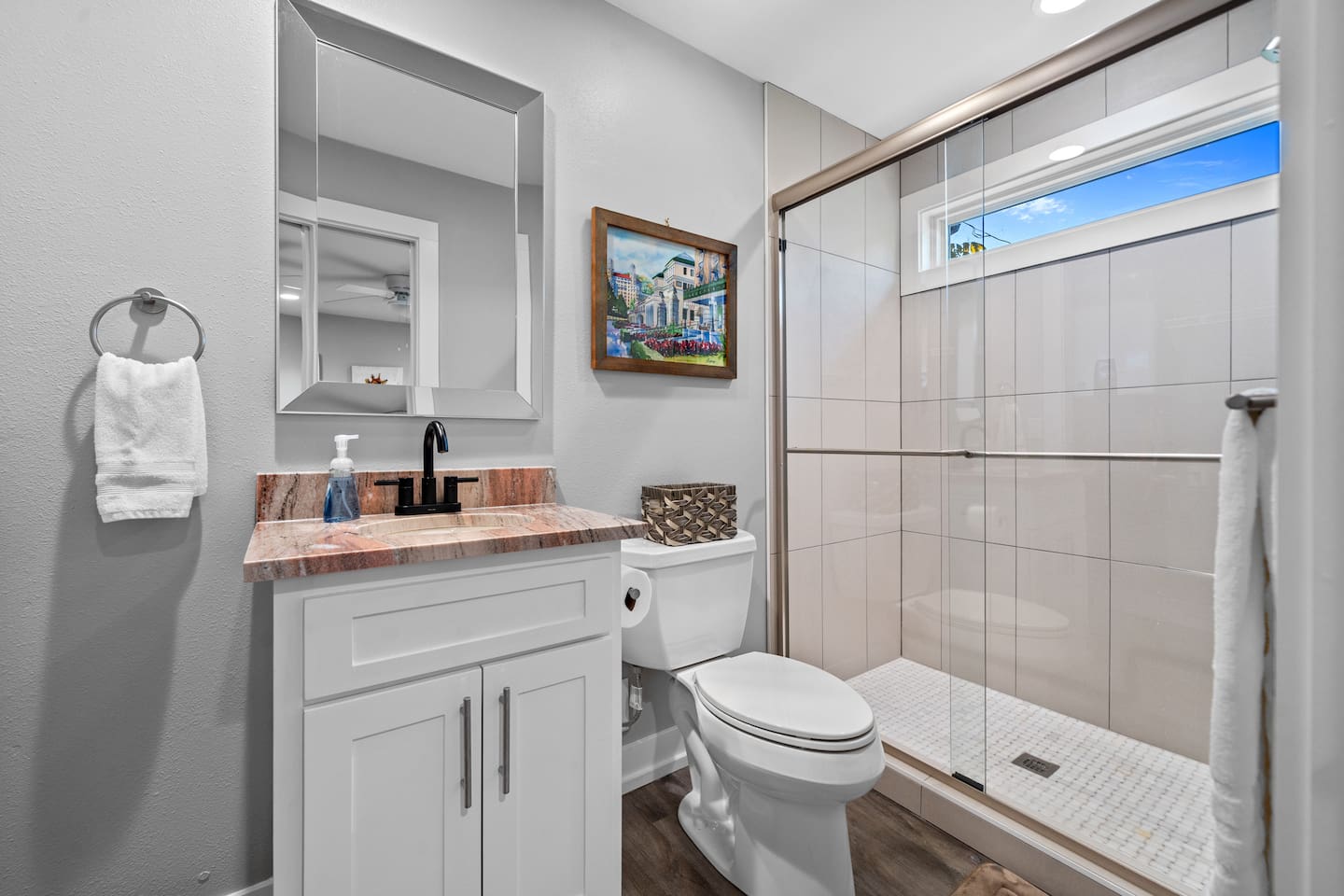 The Ensuite Bath attached to the Primary Bedroom features a Custom Tile Walk In Shower!