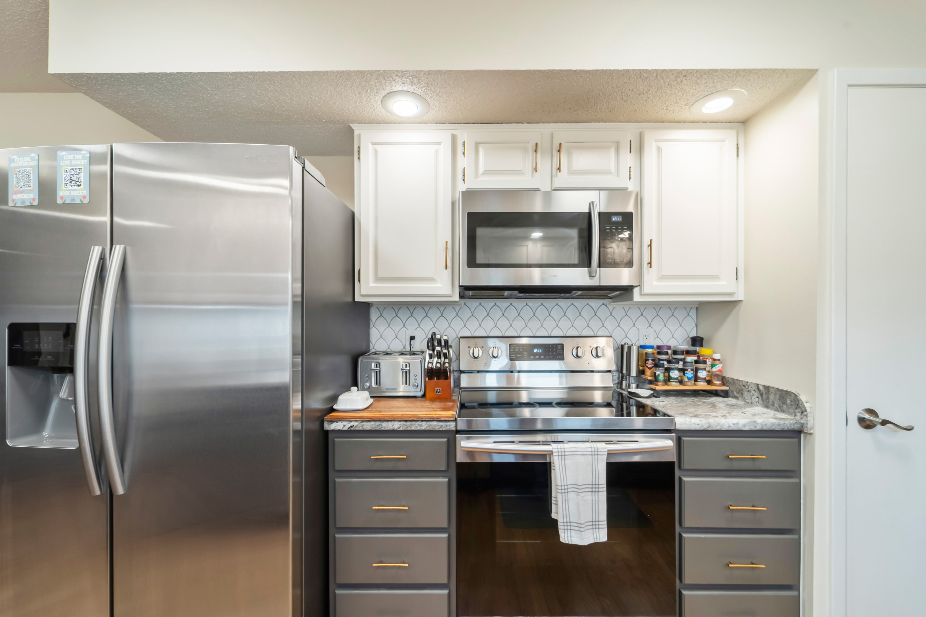 Stainless steel electric appliances with some spices, herbs, and cooking oils to get you started.