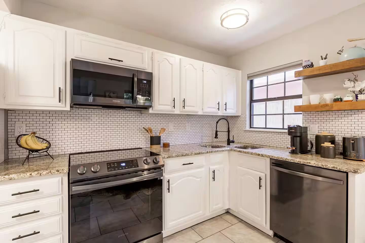 Fully equipped kitchen with modern appliances and ample counter space.