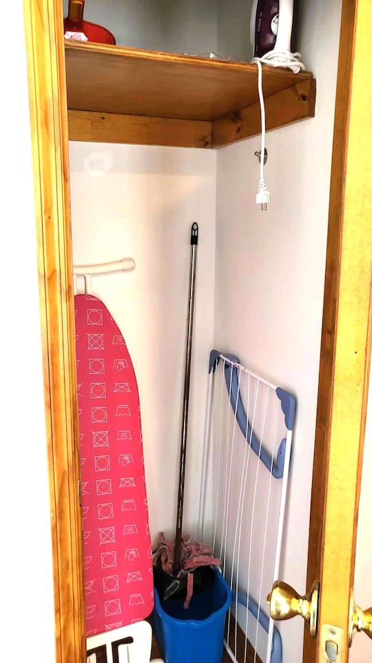Iron, Ironing board, clothes drying rack, broom, vacuum:
Located in the common area upstairs, shared between the guests.