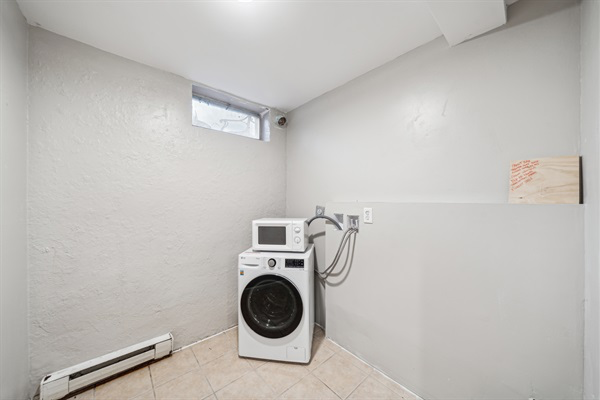 Combo washer/dryer unit. Countertop microwave available in addition to an over-the-range microwave in the kitchen.