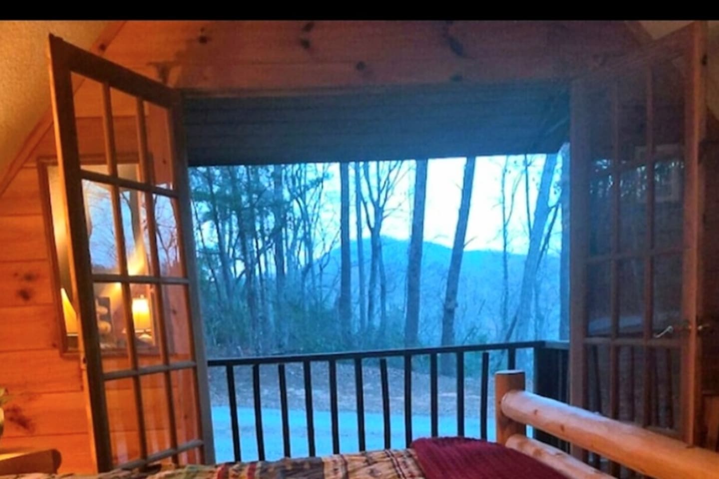 Master bedroom view from small deck. Wake up to the mountains!