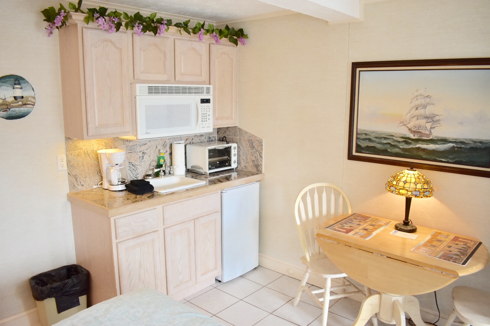 Kitchenette in the unit is complete with mini fridge, microwave, toaster oven, sink, and coffee maker