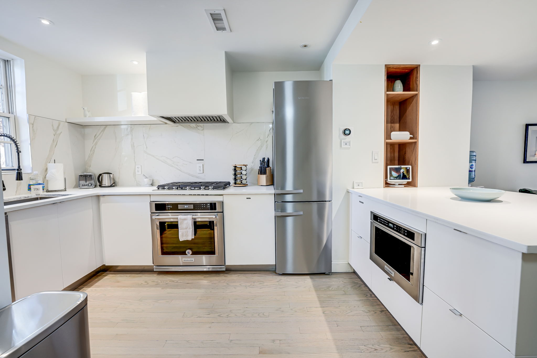 Kitchen: Stainless Steel KitchenAid Appliances, Gas Cooktop & Vent Hood.