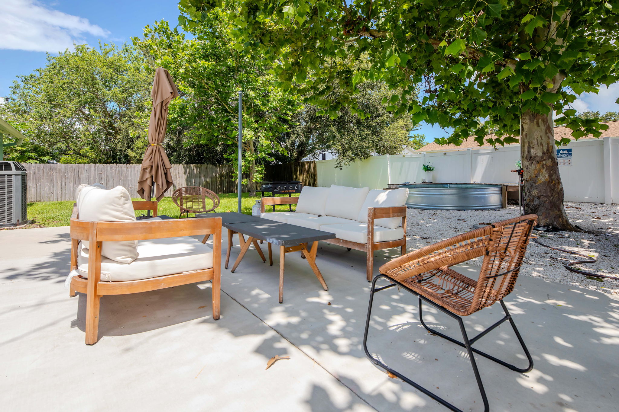 Private fenced back yard with lots of seating