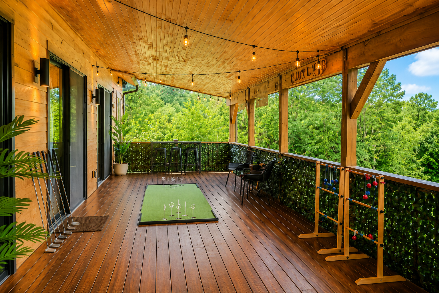 {19th Hole Deck} Covered deck game lounge with mini golf, ladder toss, bar seating, and forest views—the perfect spot for a little friendly competition at Canopy Club.
