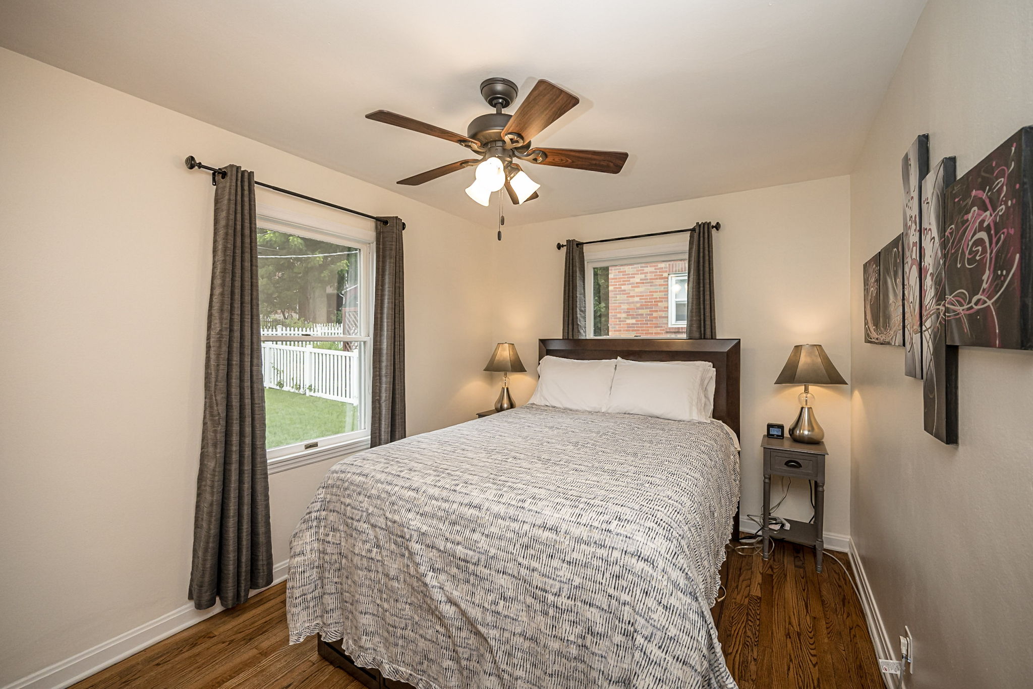 Main floor bedroom features a comfortable queen bed.