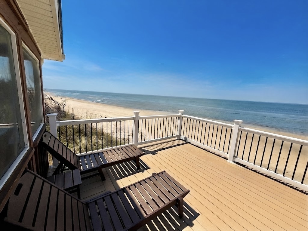 Unwind on the expansive private deck, the ultimate spot for sunset views. Lounge in comfort as the golden sun dips below the horizon over the calm ocean, providing a perfectly serene atmosphere for your luxury getaway.