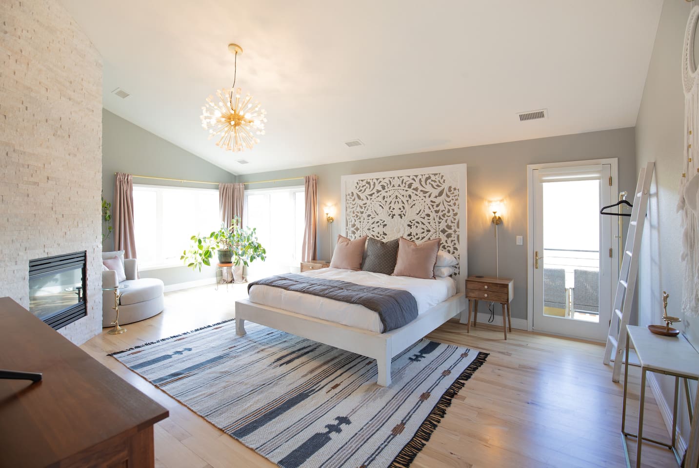 The luxurious master suite is designed for comfort and relaxation, featuring a plush king bed, cozy gas fireplace, and TV for unwinding at the end of the day. 