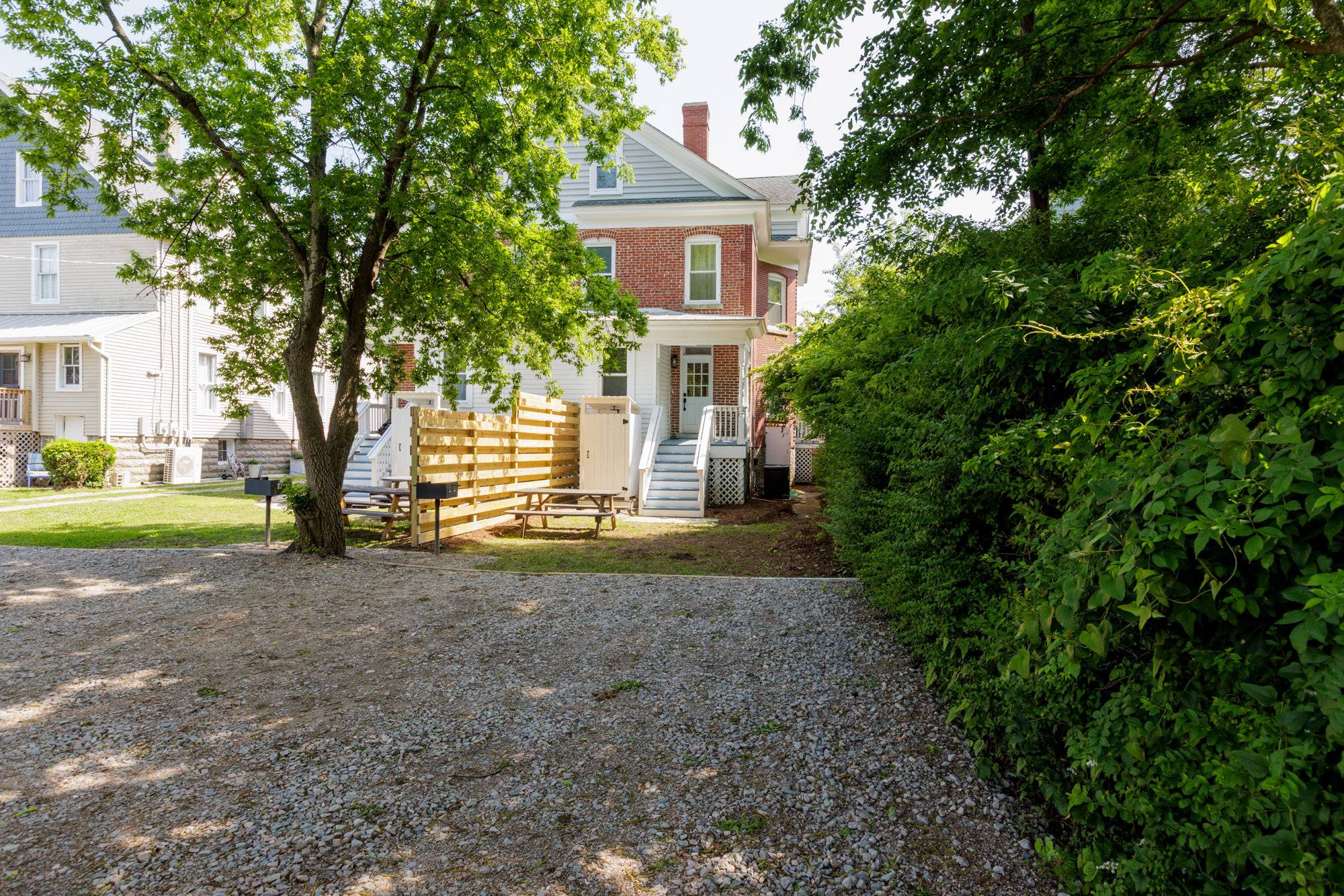 Shared backyard offers additional parking. A BBQ grill and outdoor seating have been recently installed behind the house on each side as well.