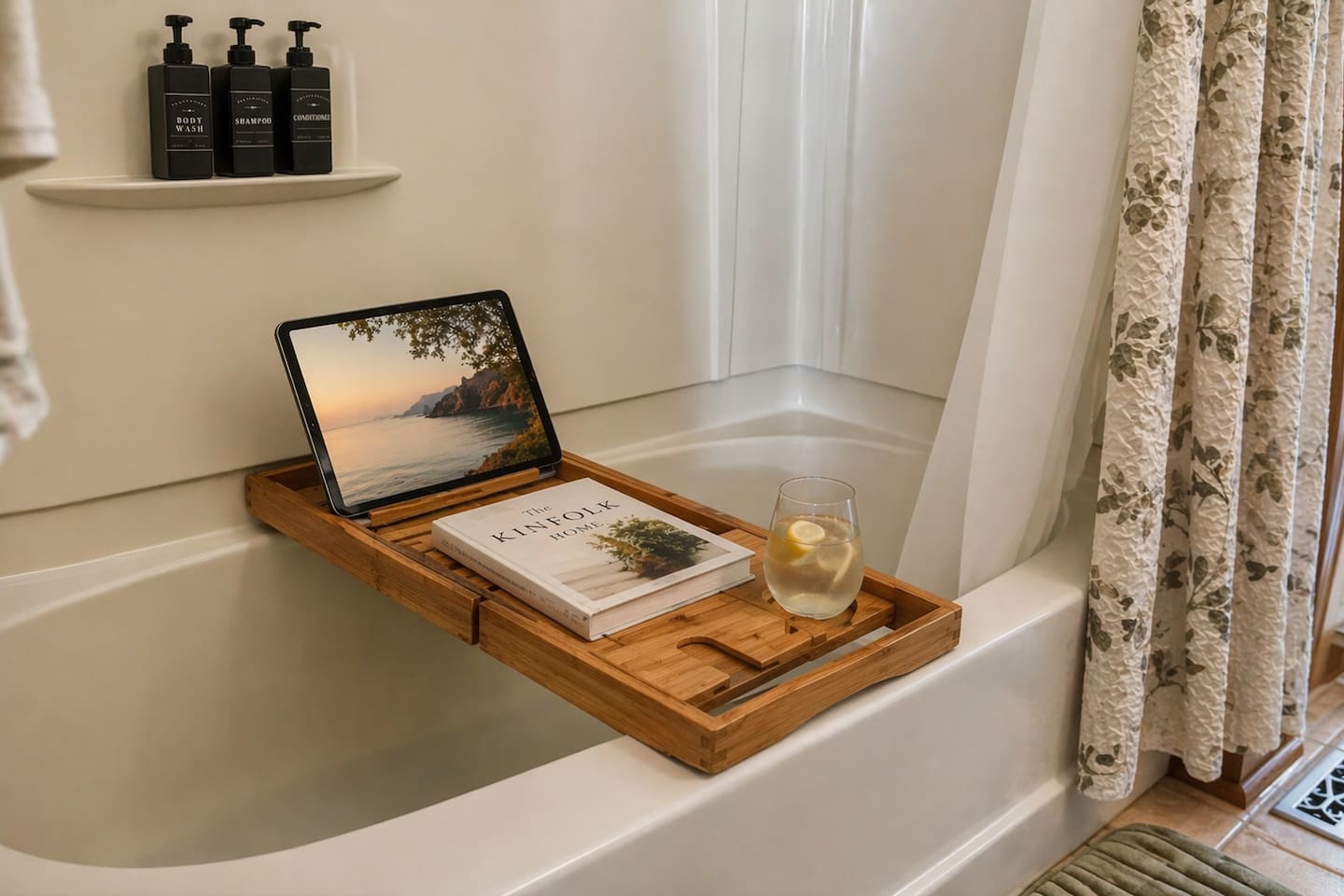 “Unwind in a clean, thoughtfully designed bathroom featuring a spacious vanity, modern fixtures, and a relaxing soaking tub. Enjoy spa-like moments with a bath tray, perfect for reading or a glass of wine after a day in the hot tub.”