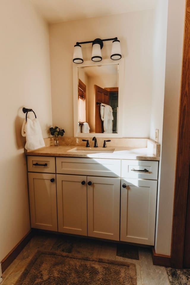 Bathroom 1 can be entered from Bedroom 1 (the primary bedroom) or the hallway