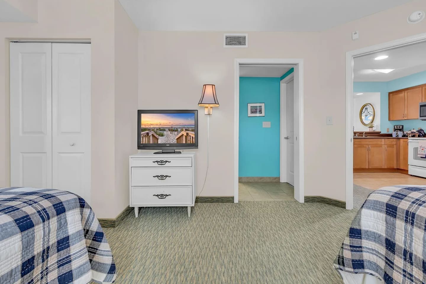 Cozy second bedroom featuring two double beds