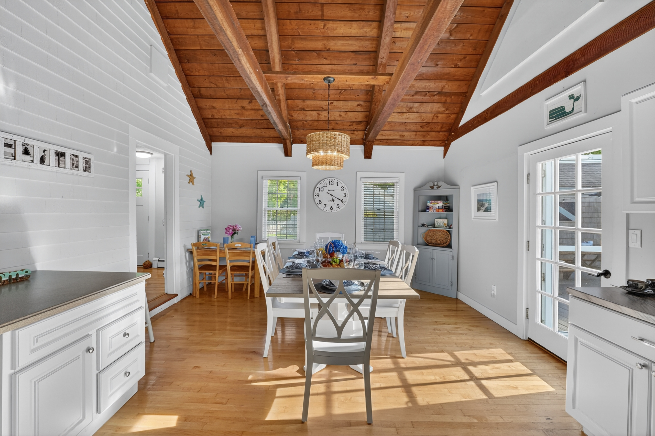 Sun-filled dining area with vaulted wood ceilings and plenty of seating for memorable family meals.