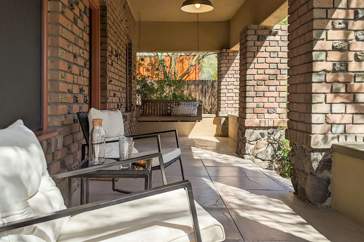 Patio with swing and chairs