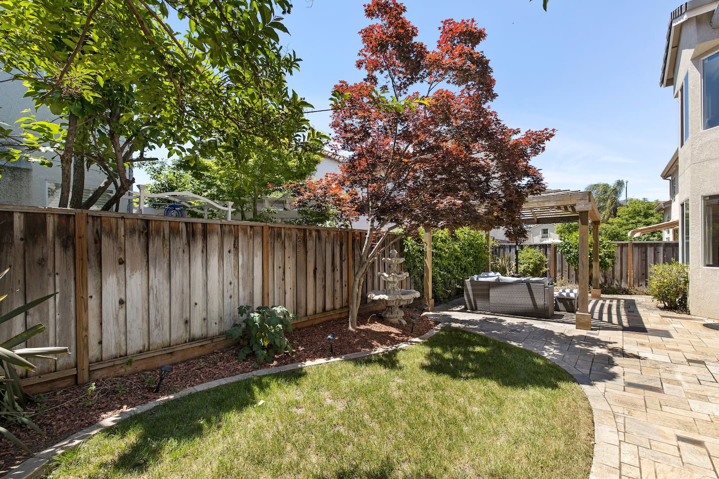 Enjoy the day or night in our spacious backyard