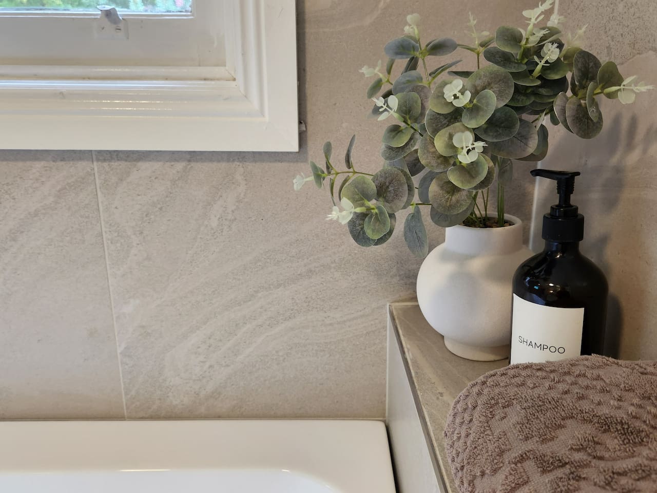 One bathroom has a shower, vanity and toilet. The second bathroom has a large bath, 4-drawer vanity and toilet. Soaps and shampoos are supplied. There is a washing machine, dryer, ironing board and iron in the second bathroom.