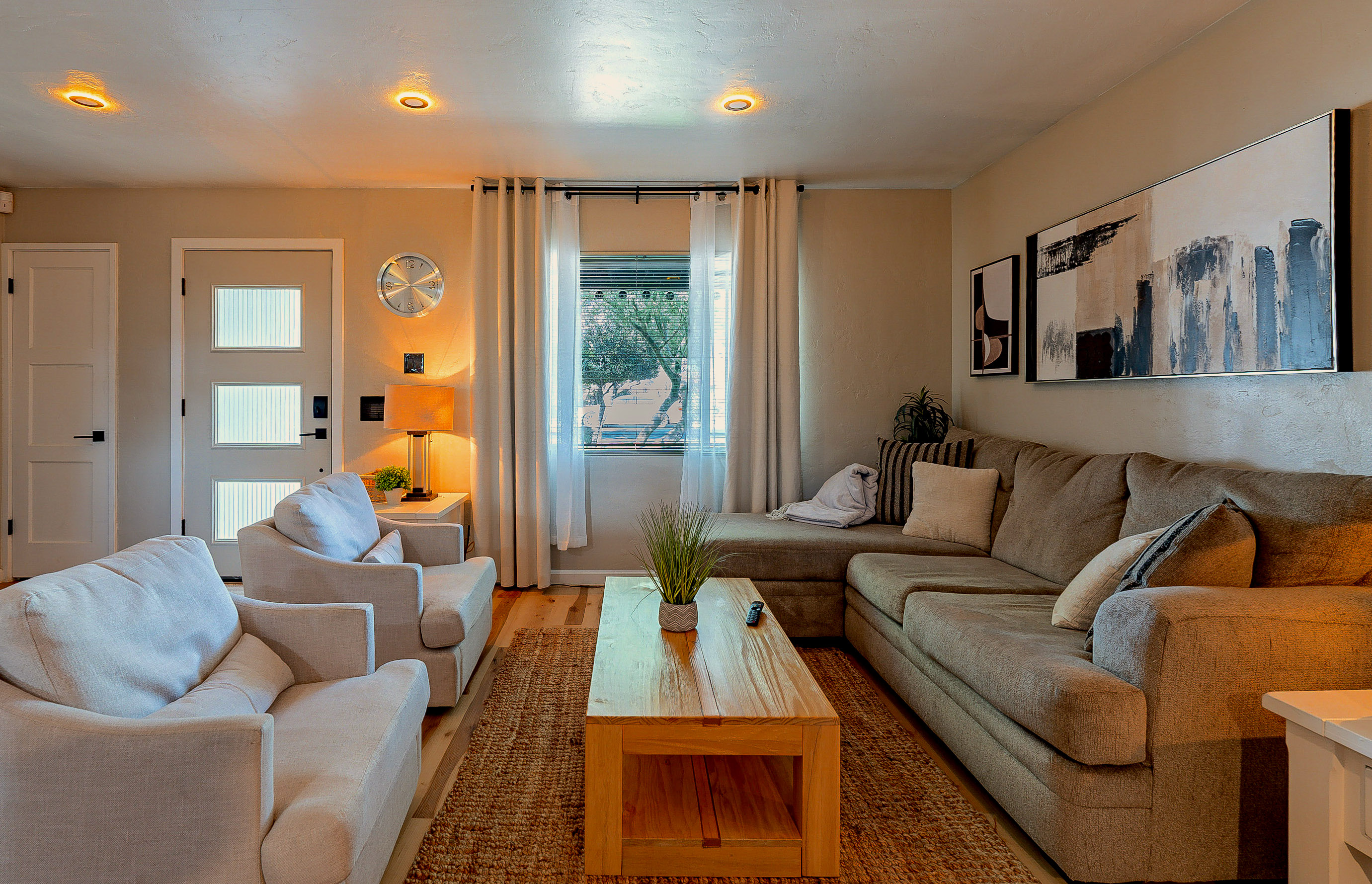 Living Room: Bright and airy space with stylish decor, perfect for gathering and unwinding!