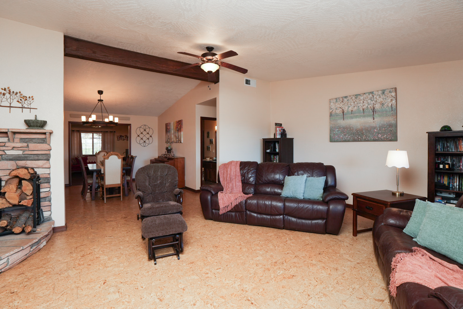 Open, inviting living room designed for gathering—plush seating, warm finishes, and easy flow to dining areas.