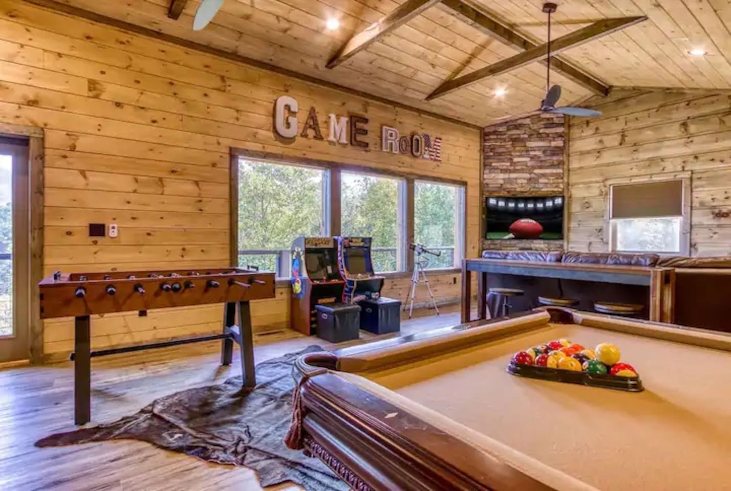 Game room features a pool table, two arcade games with multiple games, comfortable seating, large tv and a retro Nintendo with over 30 games.  Game room is on the third floor