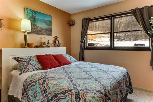 Sunrise at Sea features a comfortable king bed and a fun seaside theme cheerfully out of place in Western Wisconsin!
