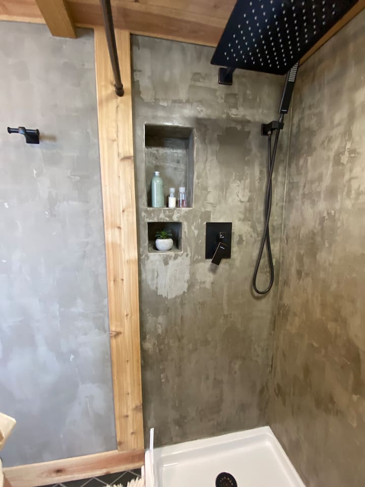 Rainfall shower head. Smart phone compatibility to the bluetooth speaker in the ceiling shower light. 