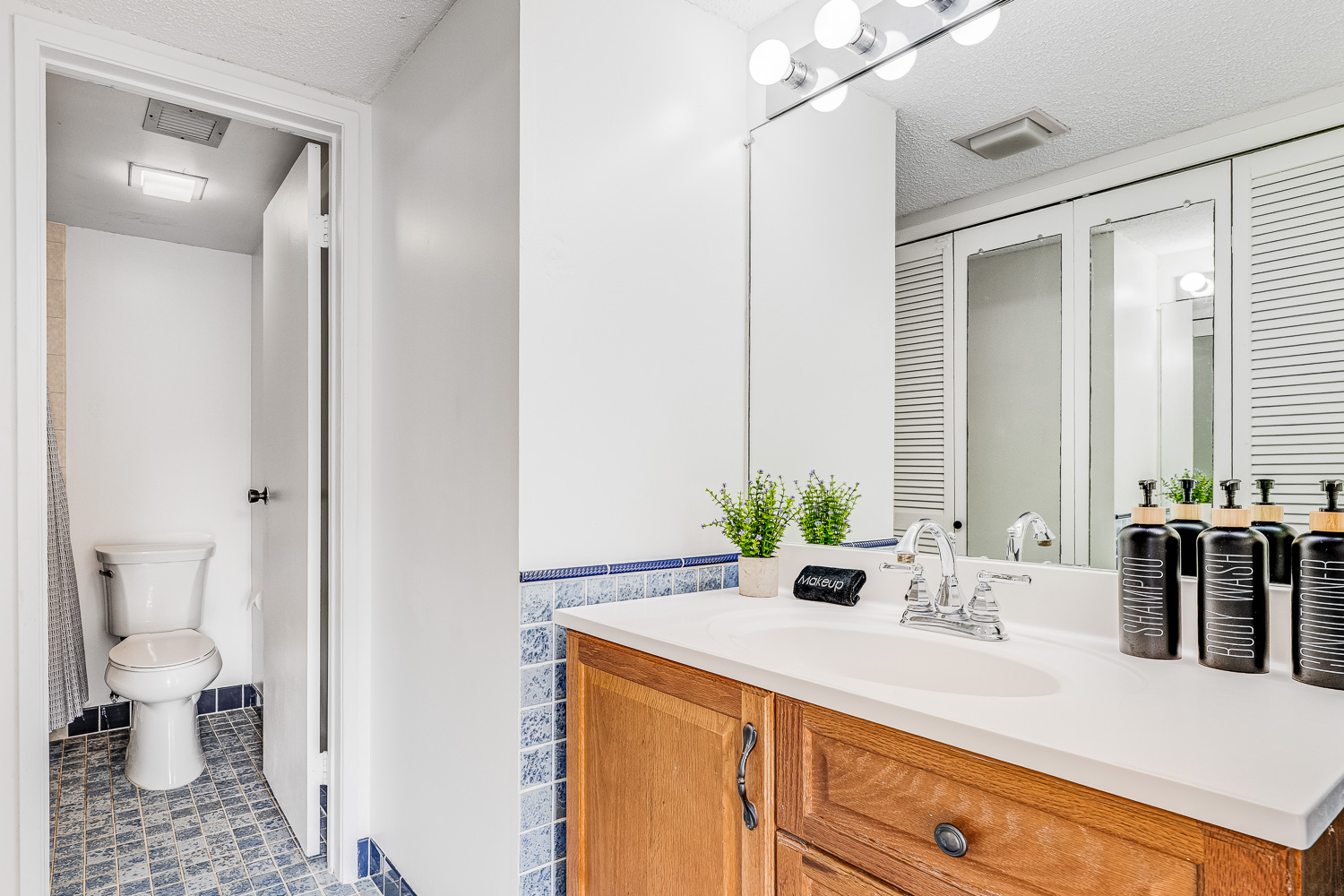 Separate shower and sink areas make it easy to share the space
