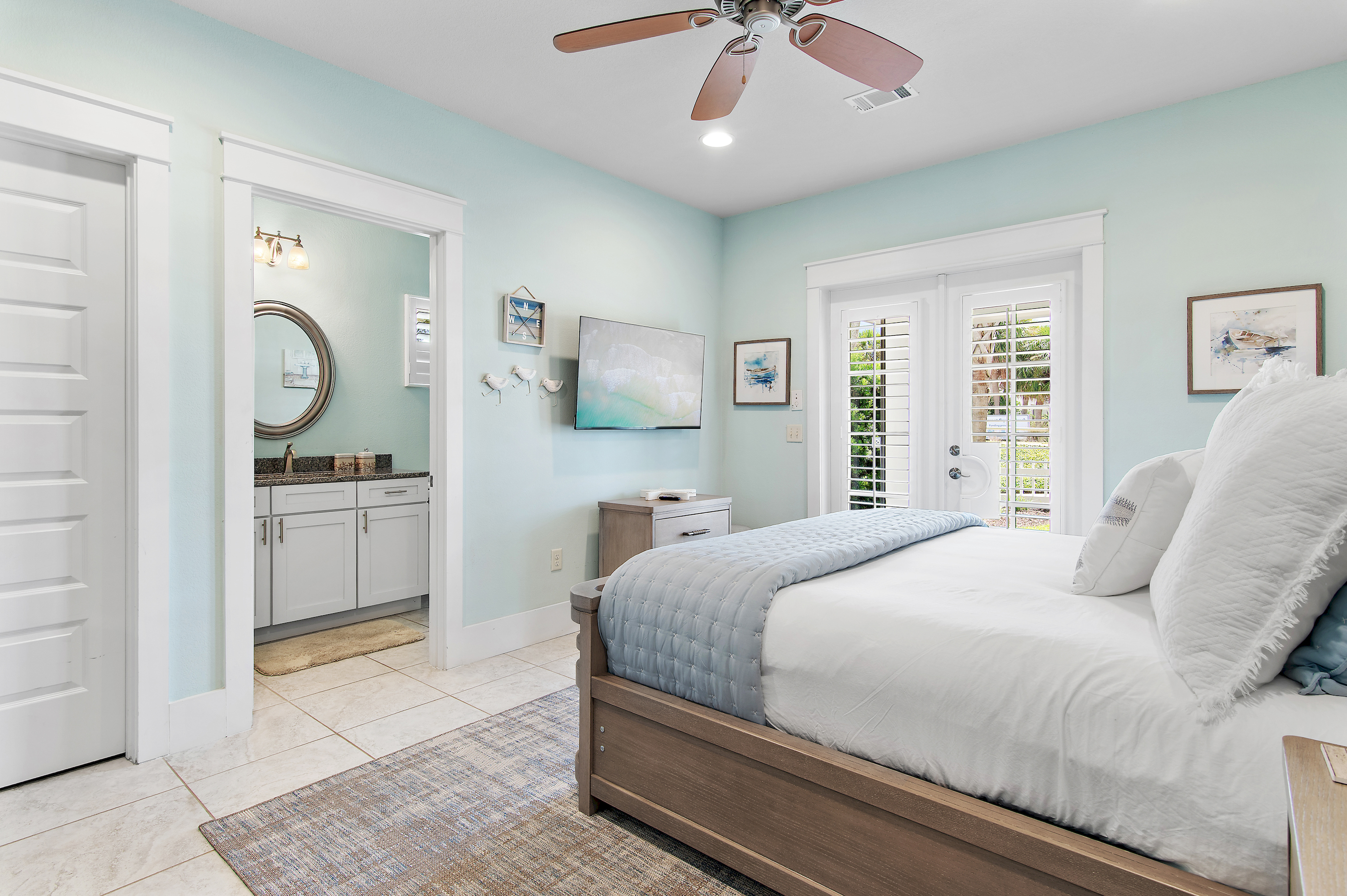 Relax in this beautifully appointed coastal bedroom, featuring a comfortable king bed and soothing beach inspired décor.
