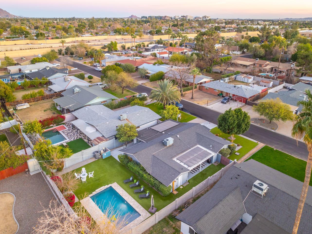 Aerial view showcasing the full layout of the area, offering a unique perspective of the pool, garden, and surrounding landscape.