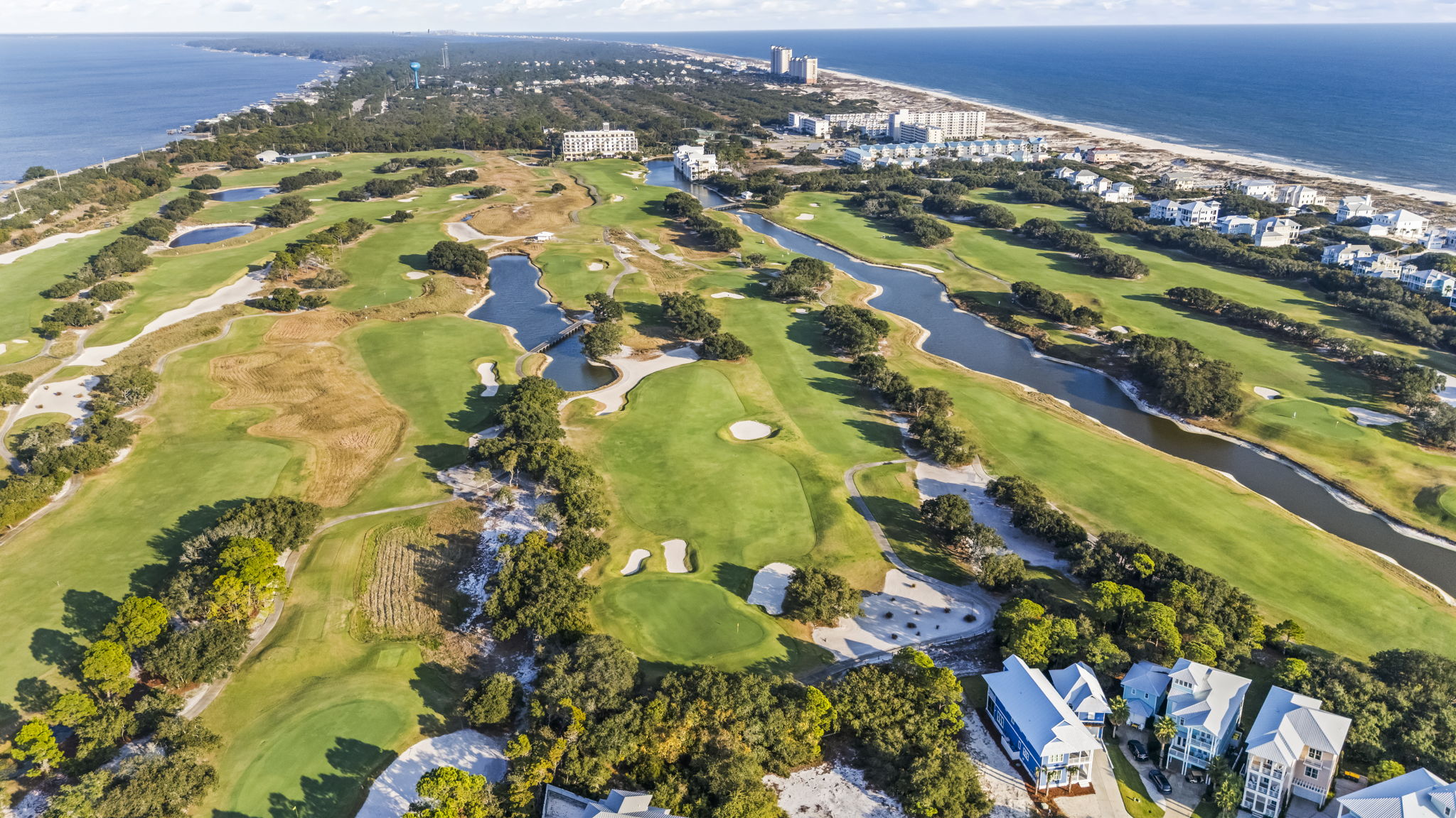 Kiva Dunes Golf Course—an award-winning links-style course set along the Gulf Coast, with rolling fairways, coastal dunes, and water features woven throughout the neighborhood.