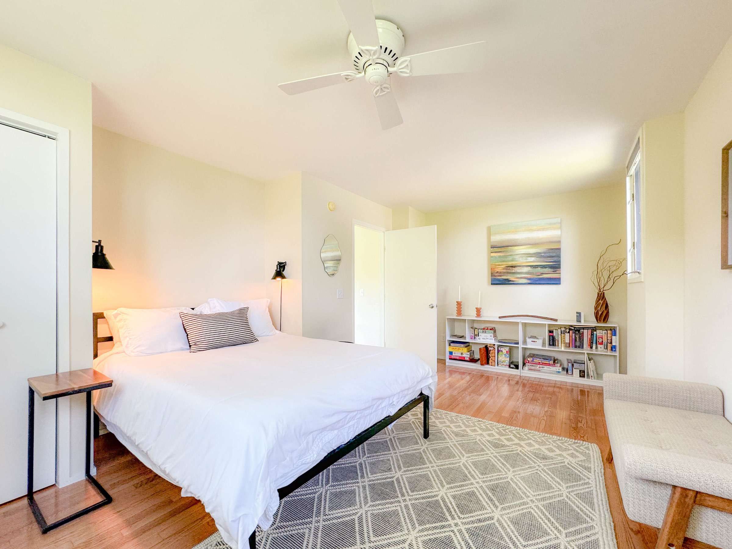 large upstairs bedroom with a queen bed