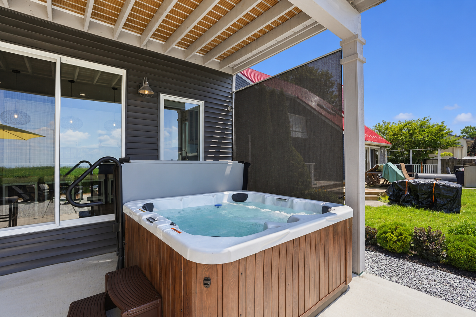 Relax in the private hot tub under the covered patio while enjoying fresh lake breezes. The perfect spot to unwind after boating, fishing, or exploring nearby Lake St. Clair attractions.